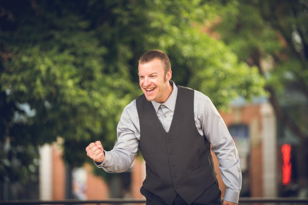 Jason Chadock celebrating with a fist pump, energetic and victorious