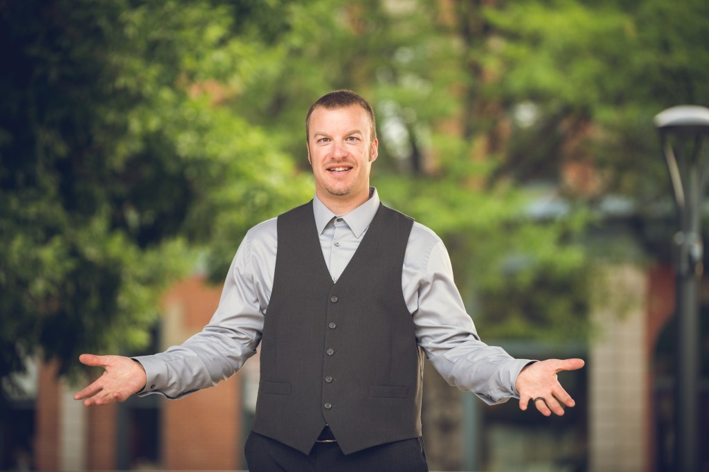 Jason Chadock with open welcoming arms, approachable and ready to connect